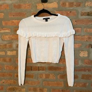 White sweater with ruffle detail